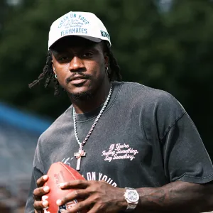 Football player holds a football