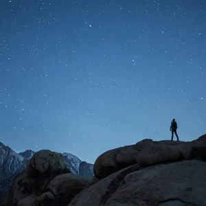 Man silhouetted against a night sky
