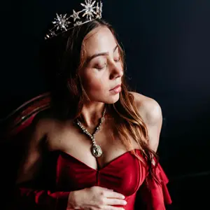 Model wearing snowflake crown poses