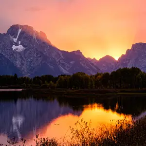 Sunset mountain range reflected in a lake