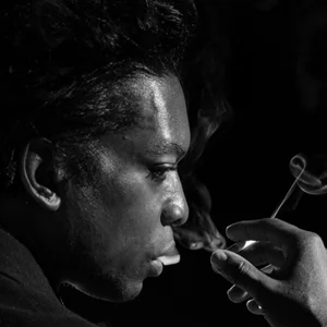 stylish portrait of a man smoking a cigarette 
