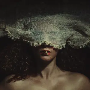 Woman with cloth over eyes and moth on mouth