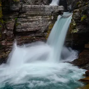 Waterfall flowing from cliffs