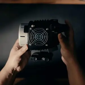 Hands holding photography gear