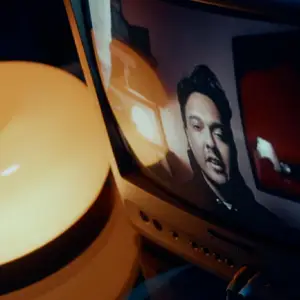 Man on a monitor screen