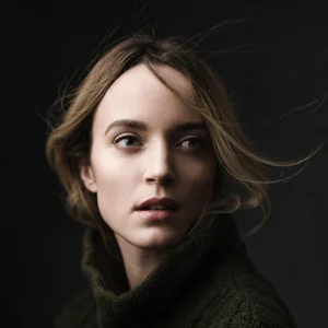 classical style portrait of a girl with hair blowing