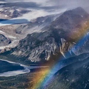 landscape photo of a mountain with a rainbow in the foreground