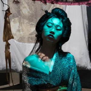 model poses in blue light