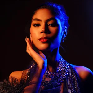 a woman lit in blue and orange