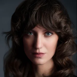 long haired model looks into the camera