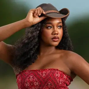 Woman in a red bandana top and cowboy hat
