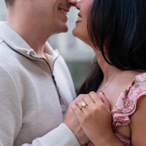 a loving couple embrace, smiling
