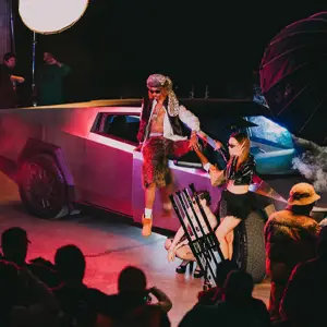 Studio lighting workshop with models and a futuristic car