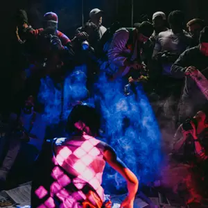 Photographers taking pics of a model on a set