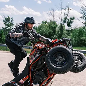 Quad stunt rider doing wheelie