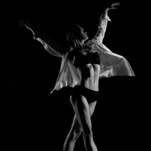 black and white photo of a dancer in black lingerie
