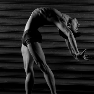 a dancer arching his back