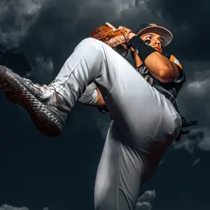 Baseball pitcher winds up a pitch