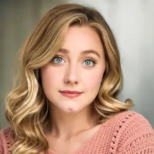 Blonde woman in pink knit sweater