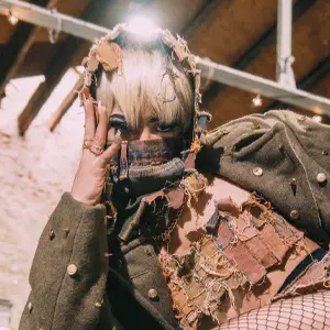 Model with fashionable outfit and face covering