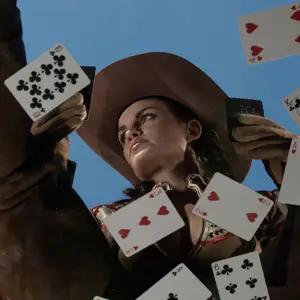 Cowgirl with playing cards scattered