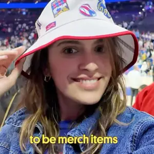 Woman with bucket hat at Philadelphia 76ers basketball game