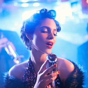 singer holding a microphone on stage