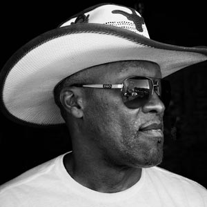 Black and white photo of a man in a cowboy hat