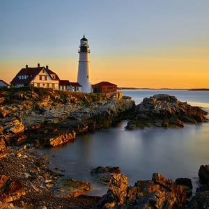 Photo of a lighthouse at sunrise